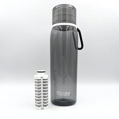 Filter water bottle next to its removable alkaline filter.