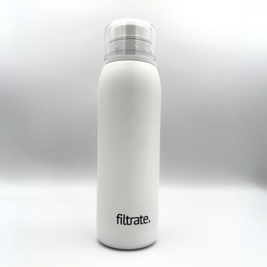 White filter water bottle with transparent lid by Filtrate, standing upright against a white background.